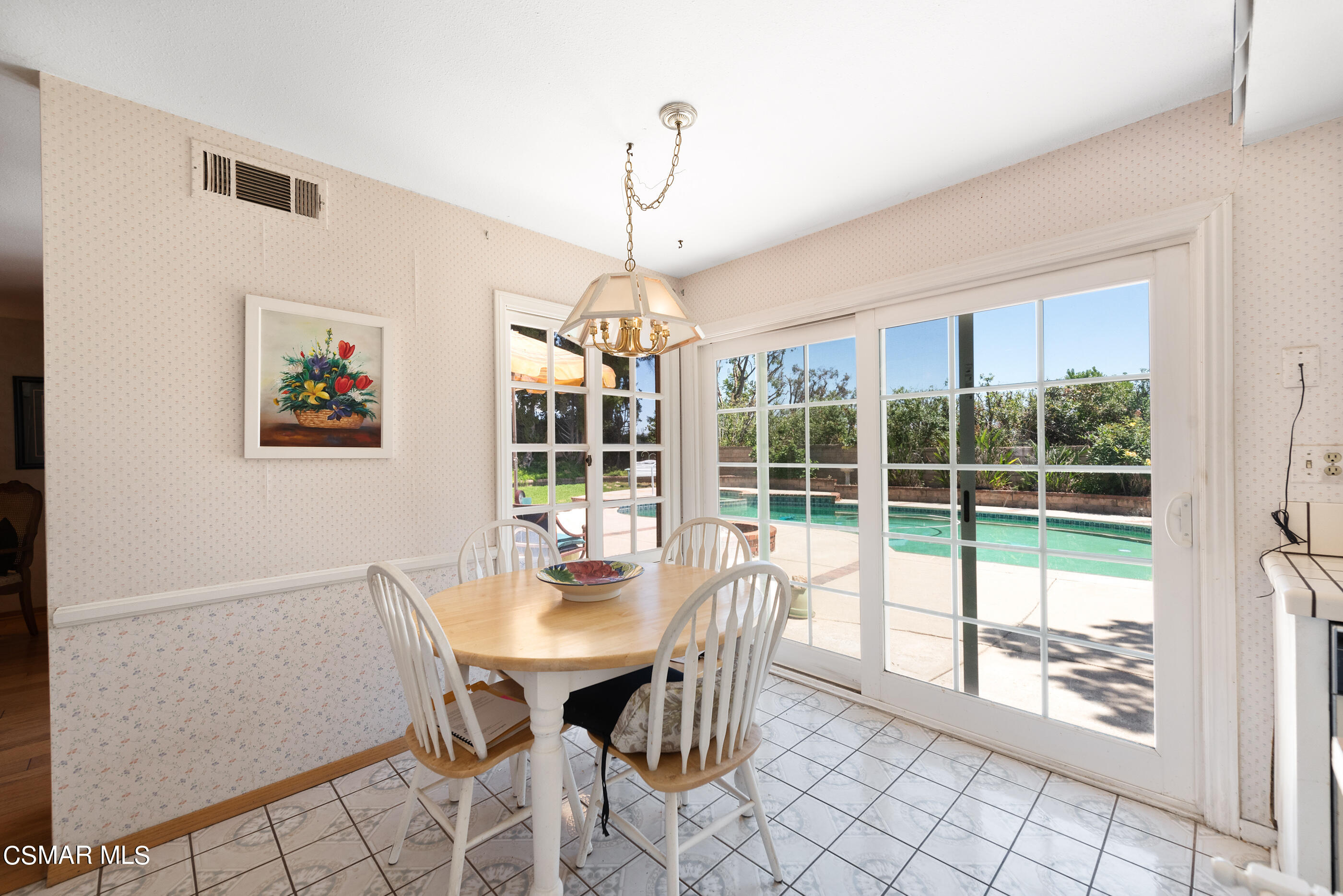 4230 Roxbury Street Simi Valley, CA 93063 - Photo 18 of 40 a view of a dining room with furniture large windows and wooden floor