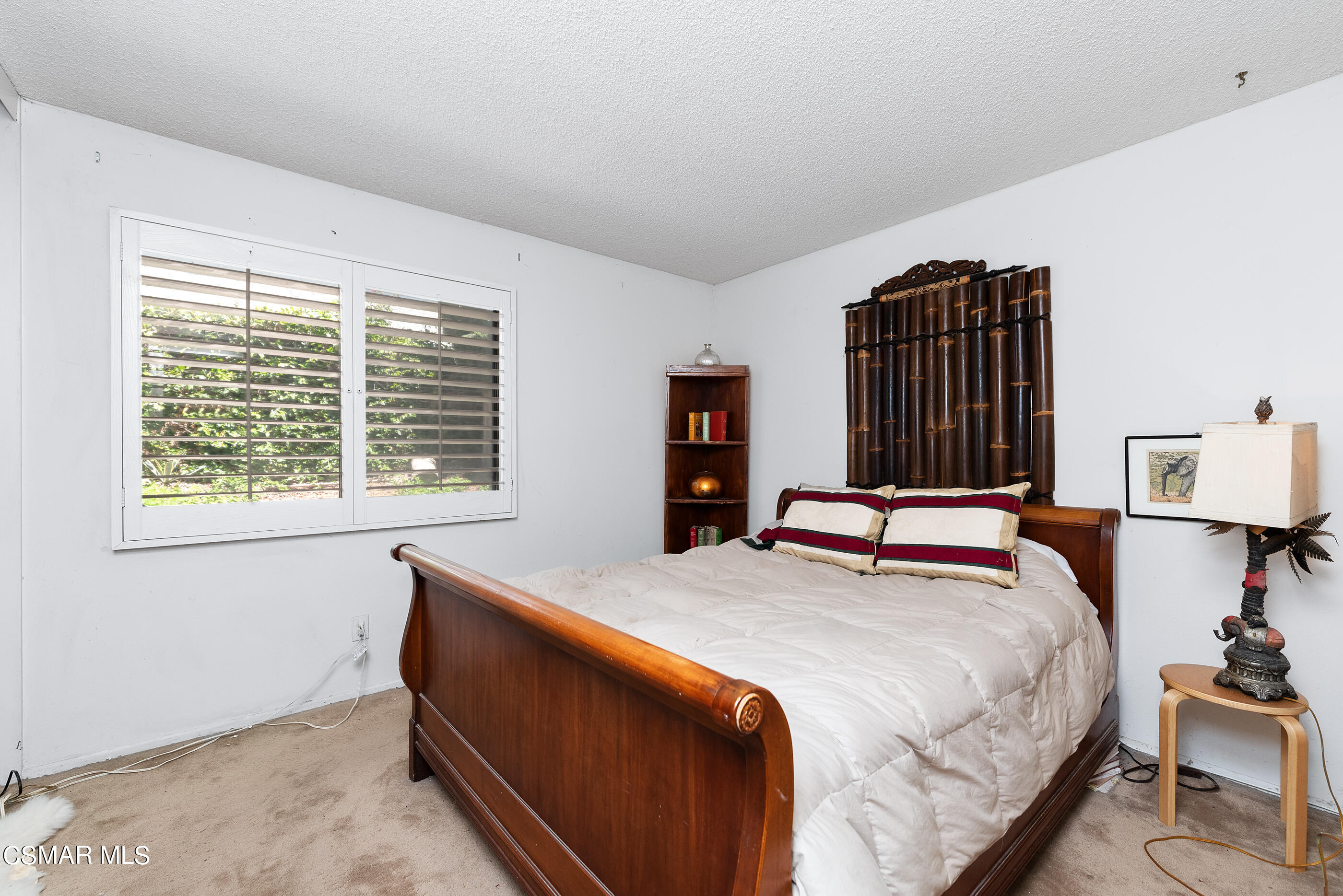 4230 Roxbury Street Simi Valley, CA 93063 - Photo 26 of 40 a bedroom with a bed and a window