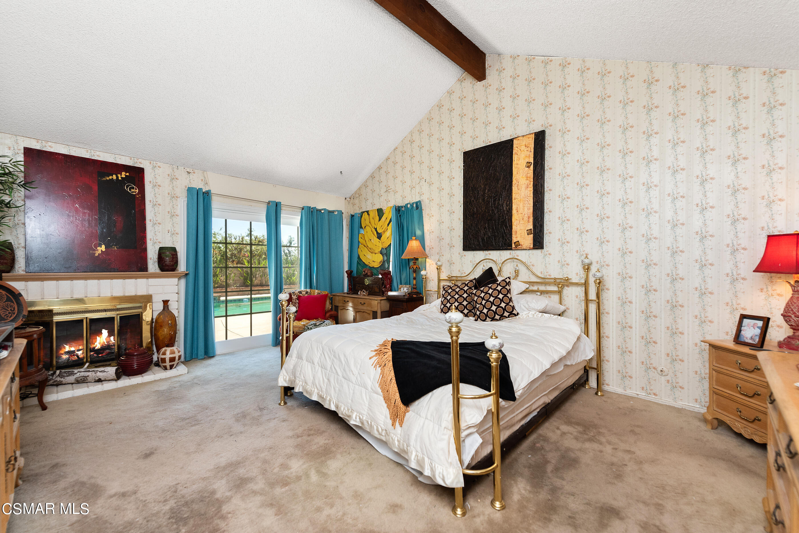 4230 Roxbury Street Simi Valley, CA 93063 - Photo 27 of 40 a bedroom with a bed and a fireplace