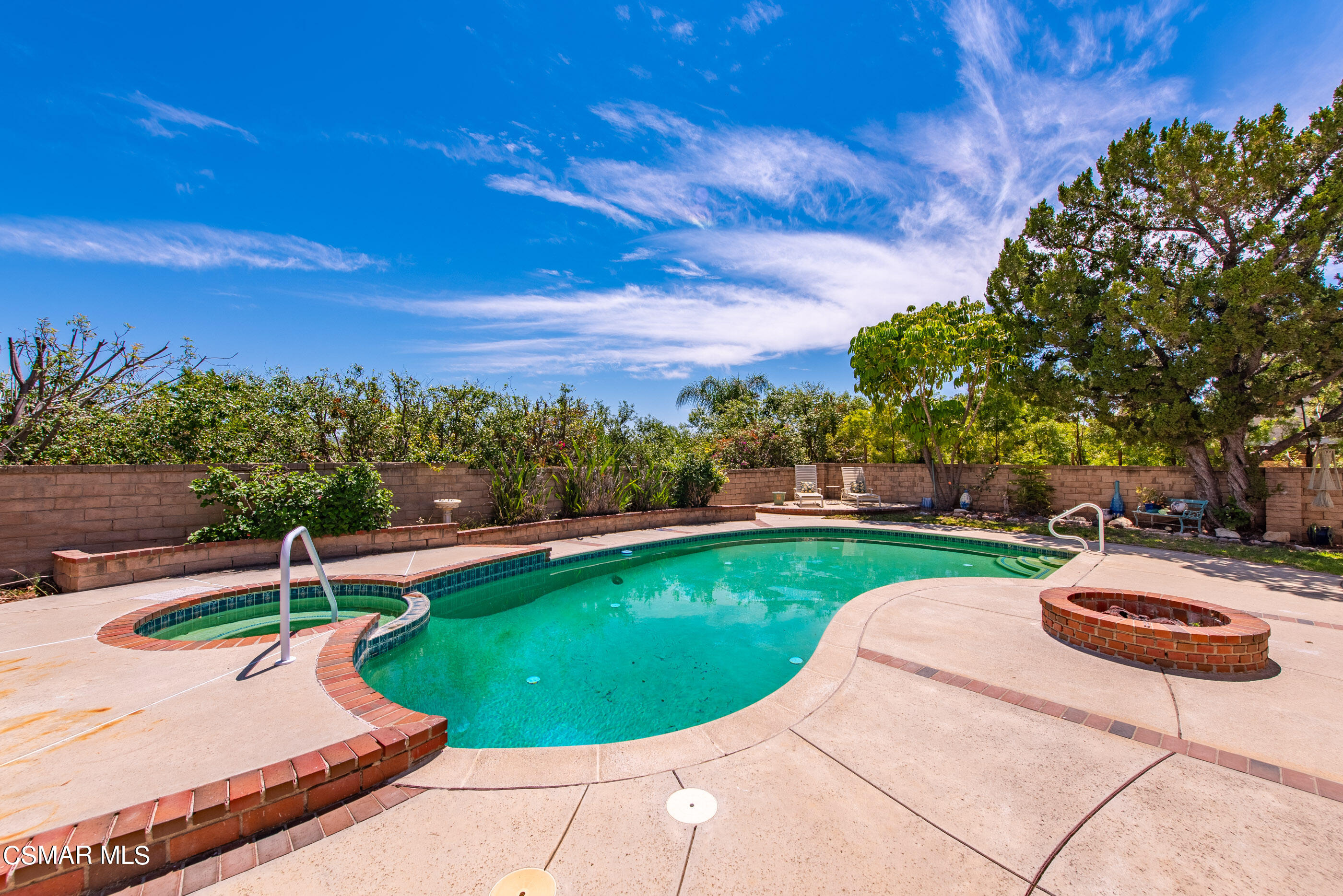 4230 Roxbury Street Simi Valley, CA 93063 - Photo 35 of 40 a view of a swimming pool and lounge chairs