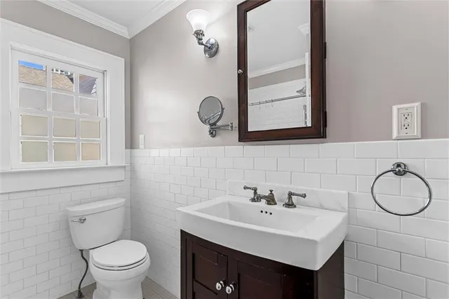 a bathroom with a sink a glass door shower and a mirror