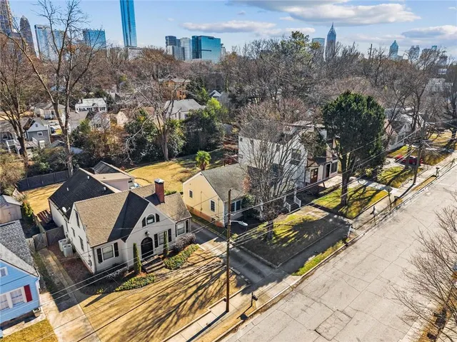 an aerial view of residential houses with outdoor space