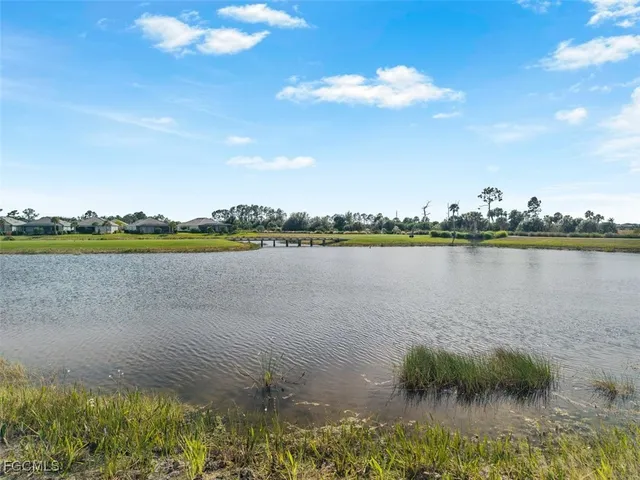 a view of a lake with a big yard