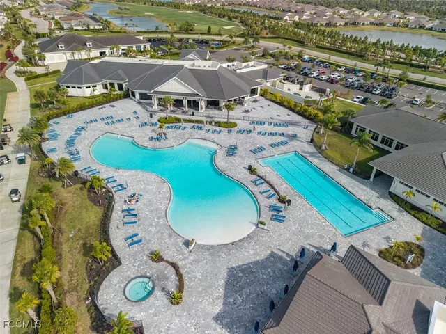 an aerial view of a house with a swimming pool