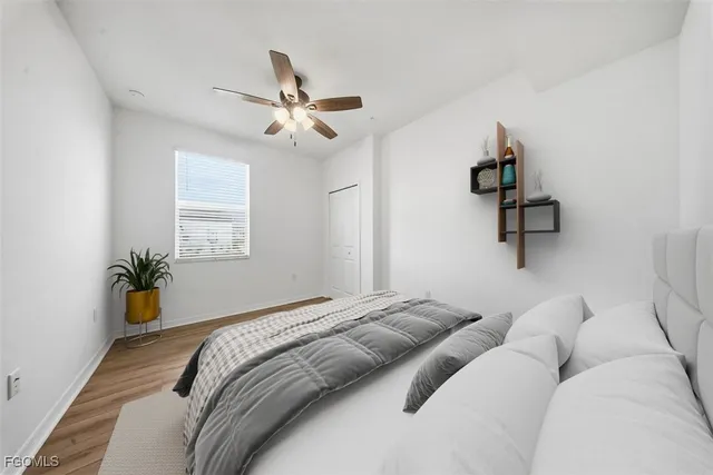 a bed room with a bed and a chandelier