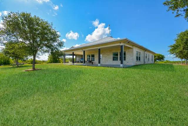 a view of a house with a big yard