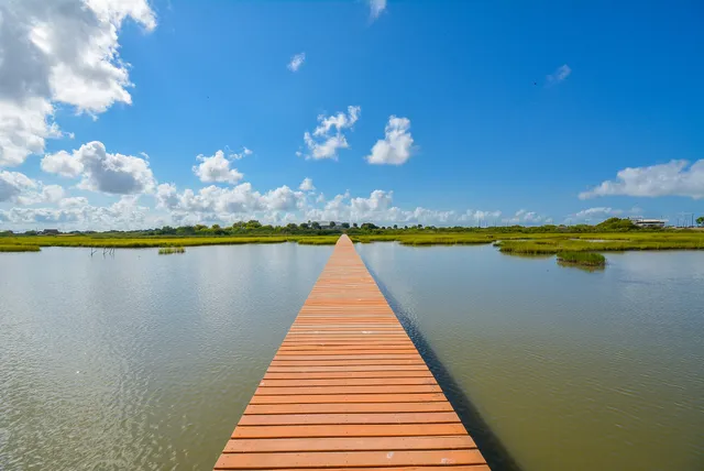 a view of swimming pool with seating space