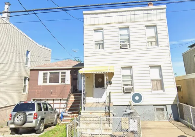 a front view of a house with a patio