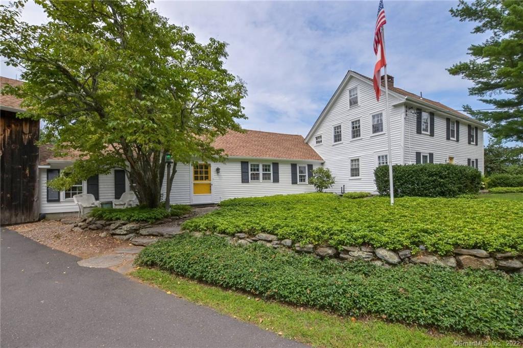 330 East Hill Road Canton, CT 06019 - Photo 1 of 1 a front view of a house with a garden