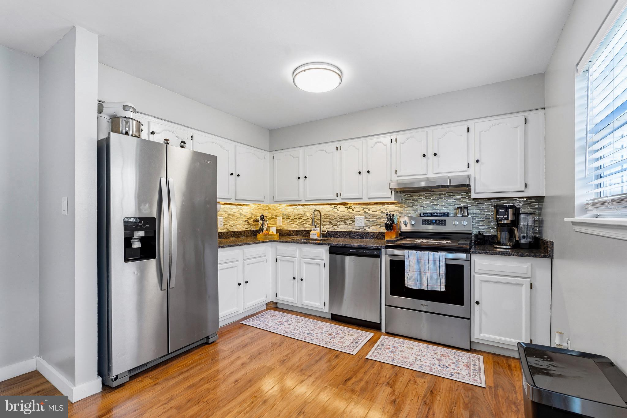 8 Anchor Court Perryville, MD 21903 - Photo 6 of 18 a kitchen with granite countertop a refrigerator stove and sink