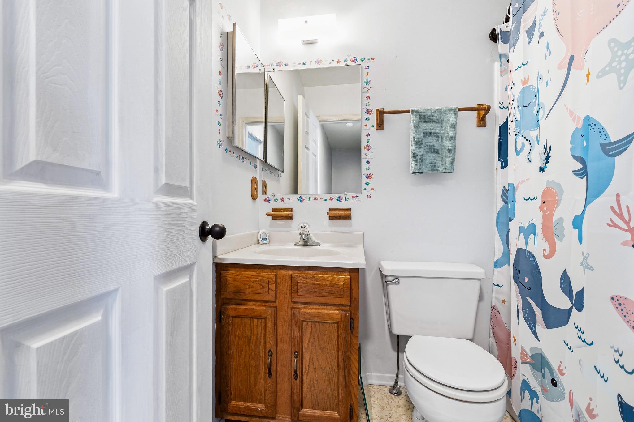 8 Anchor Court Perryville, MD 21903 - Photo 10 of 18 a white toilet sitting next to a bathroom sink
