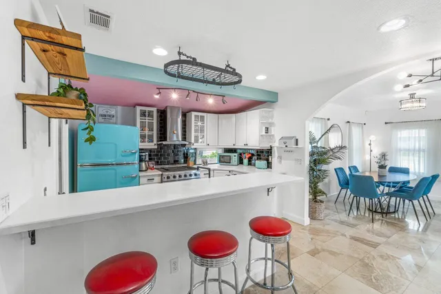 a bathroom with a toilet and shower