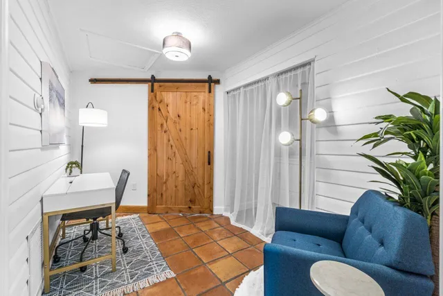 a view of an outdoor space with a table and chairs