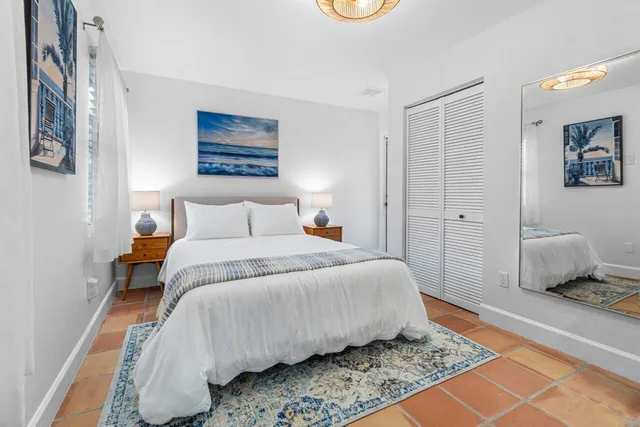 an aerial view of a houses with a yard