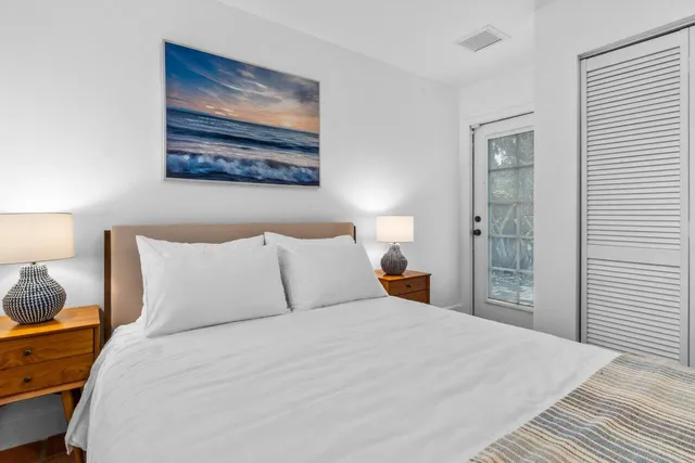 an aerial view of residential houses with outdoor space and street view