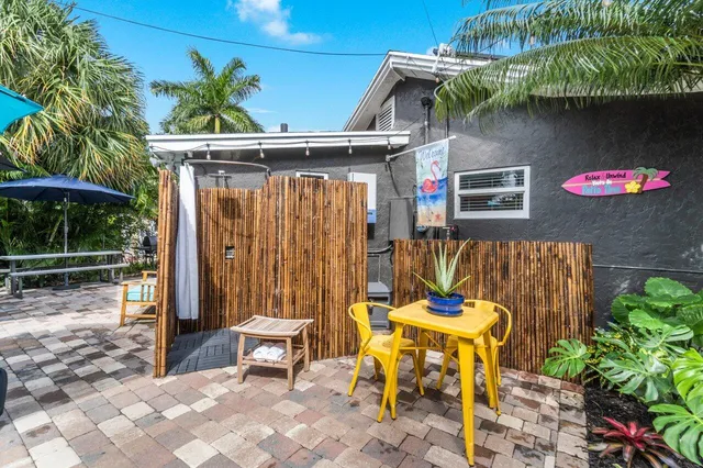 a view of a house with a small yard and plants