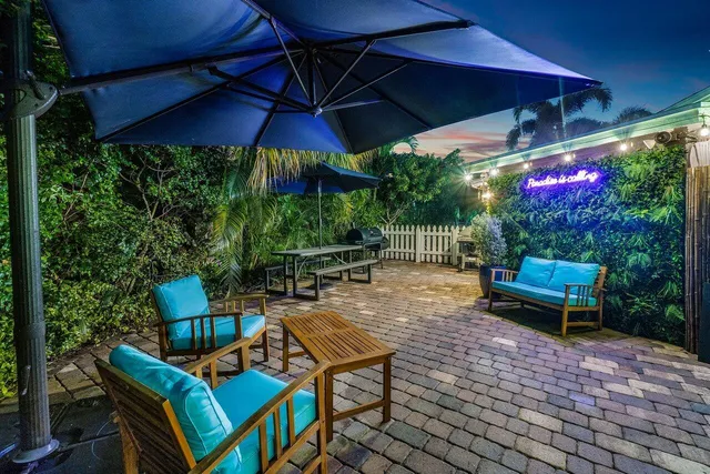 a view of a terrace with chairs and a table