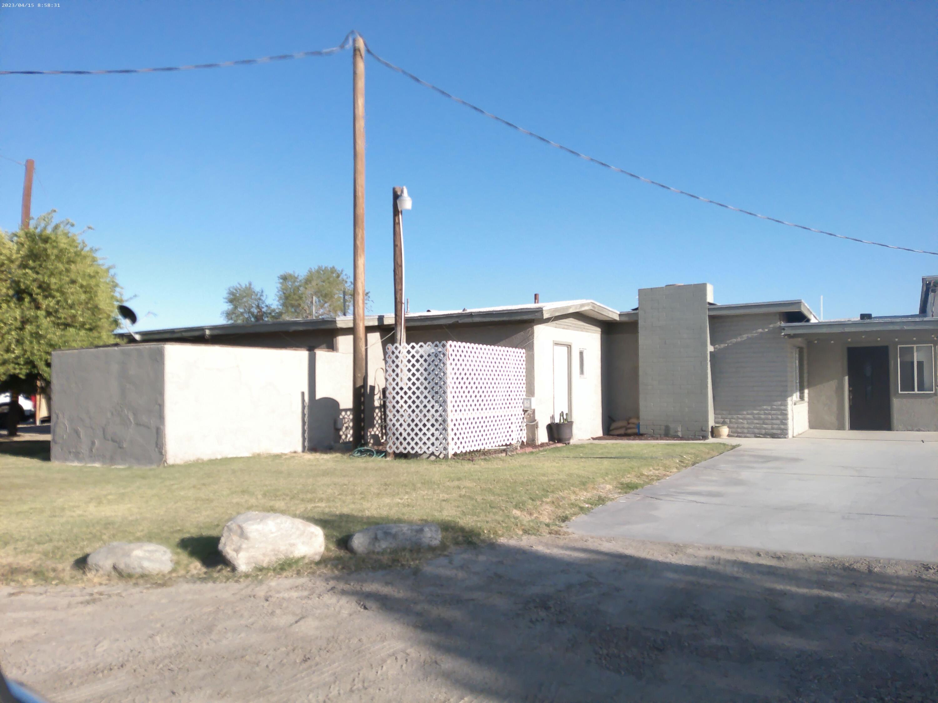 54878 Harrison Street Thermal, CA 92274 - Photo 13 of 58 a view of a house with a yard