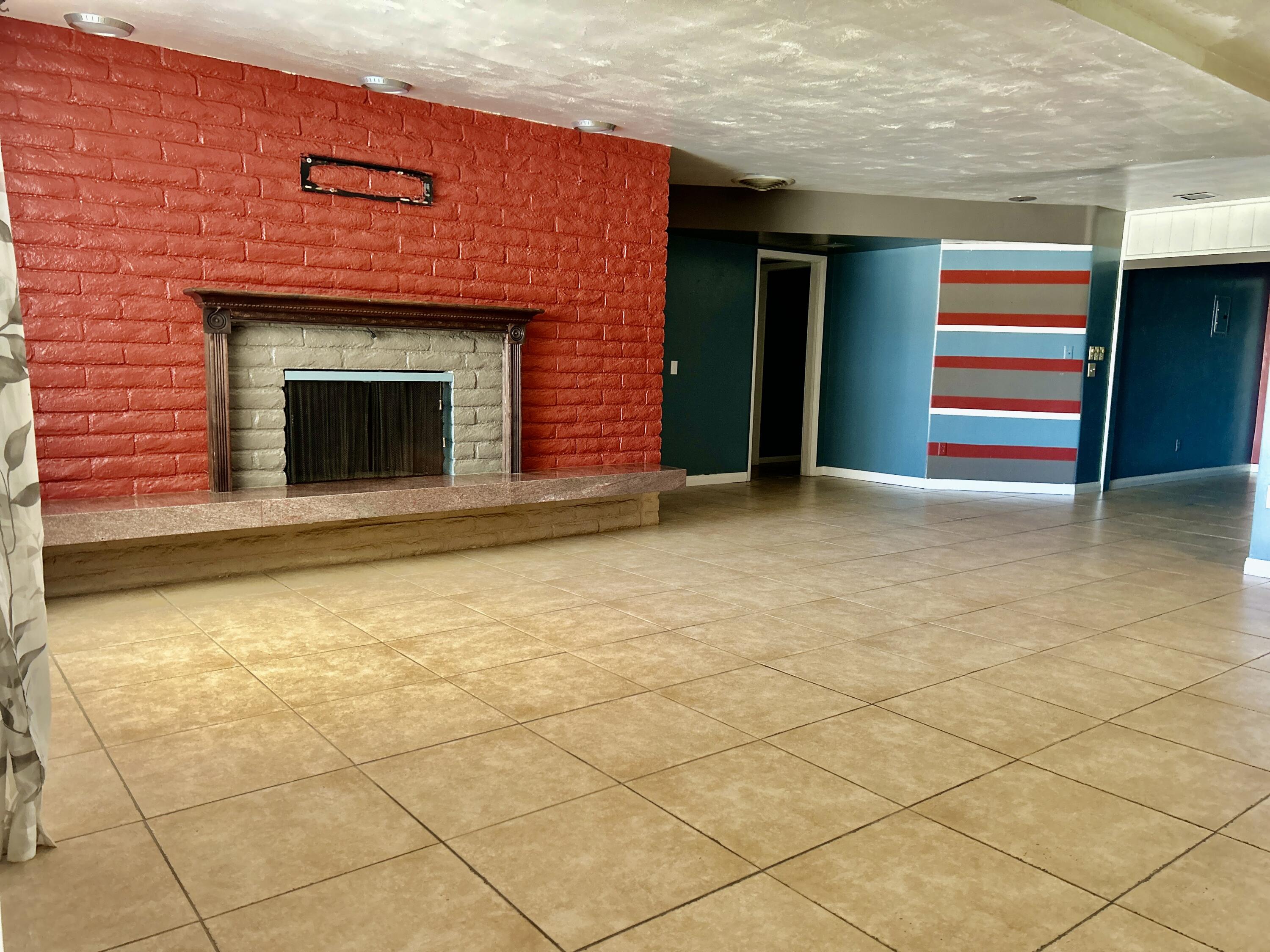 54878 Harrison Street Thermal, CA 92274 - Photo 20 of 58 a view of empty room with a fireplace