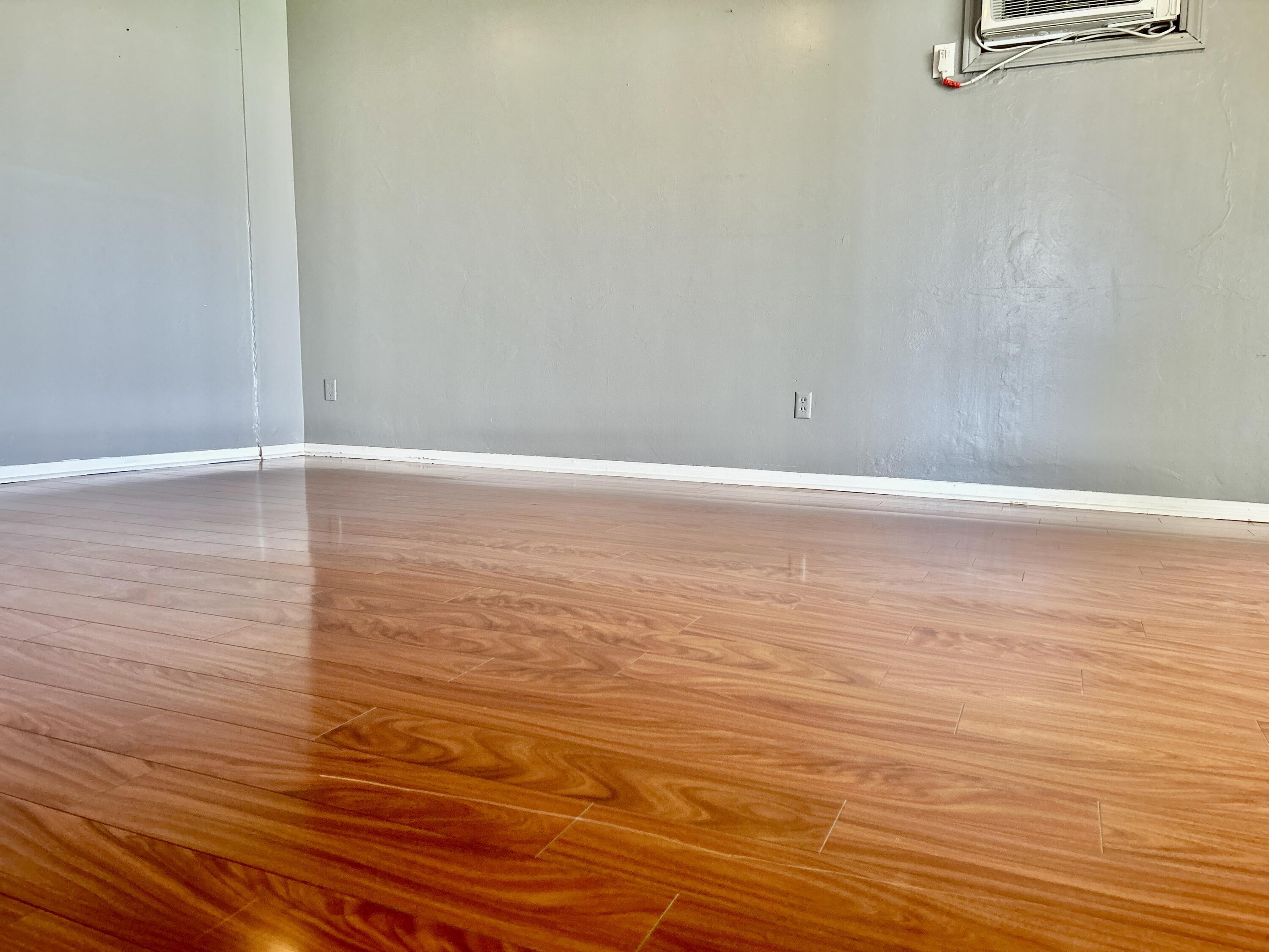 54878 Harrison Street Thermal, CA 92274 - Photo 26 of 58 a view of an empty room with wooden floor