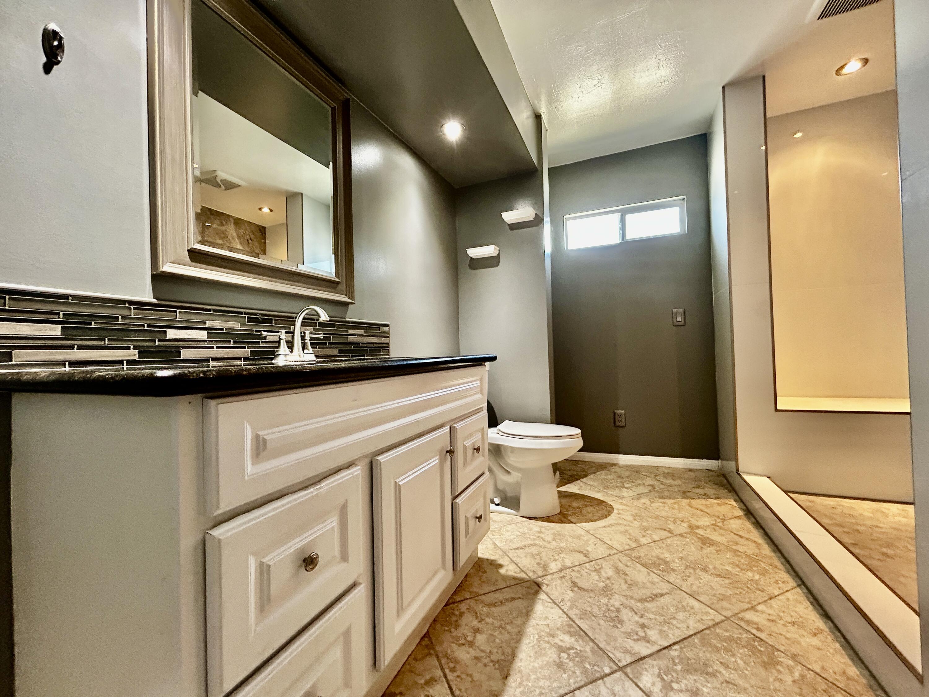 54878 Harrison Street Thermal, CA 92274 - Photo 28 of 58 a bathroom with a sink and a mirror