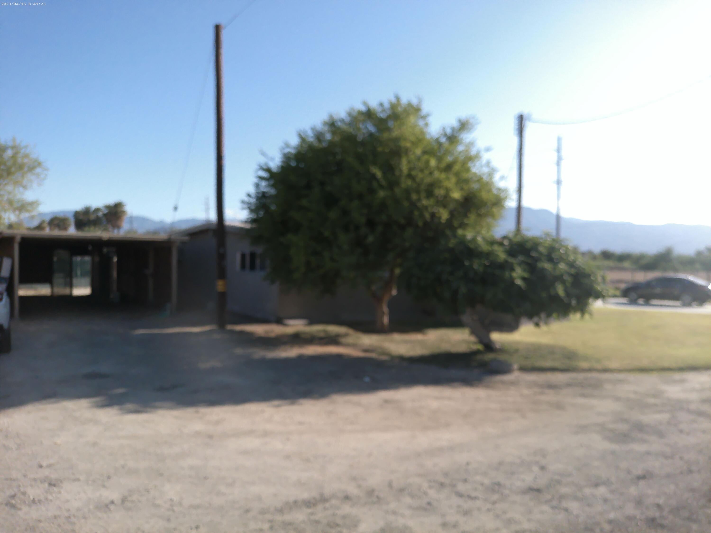 54878 Harrison Street Thermal, CA 92274 - Photo 34 of 58 a view of a yard with palm tree