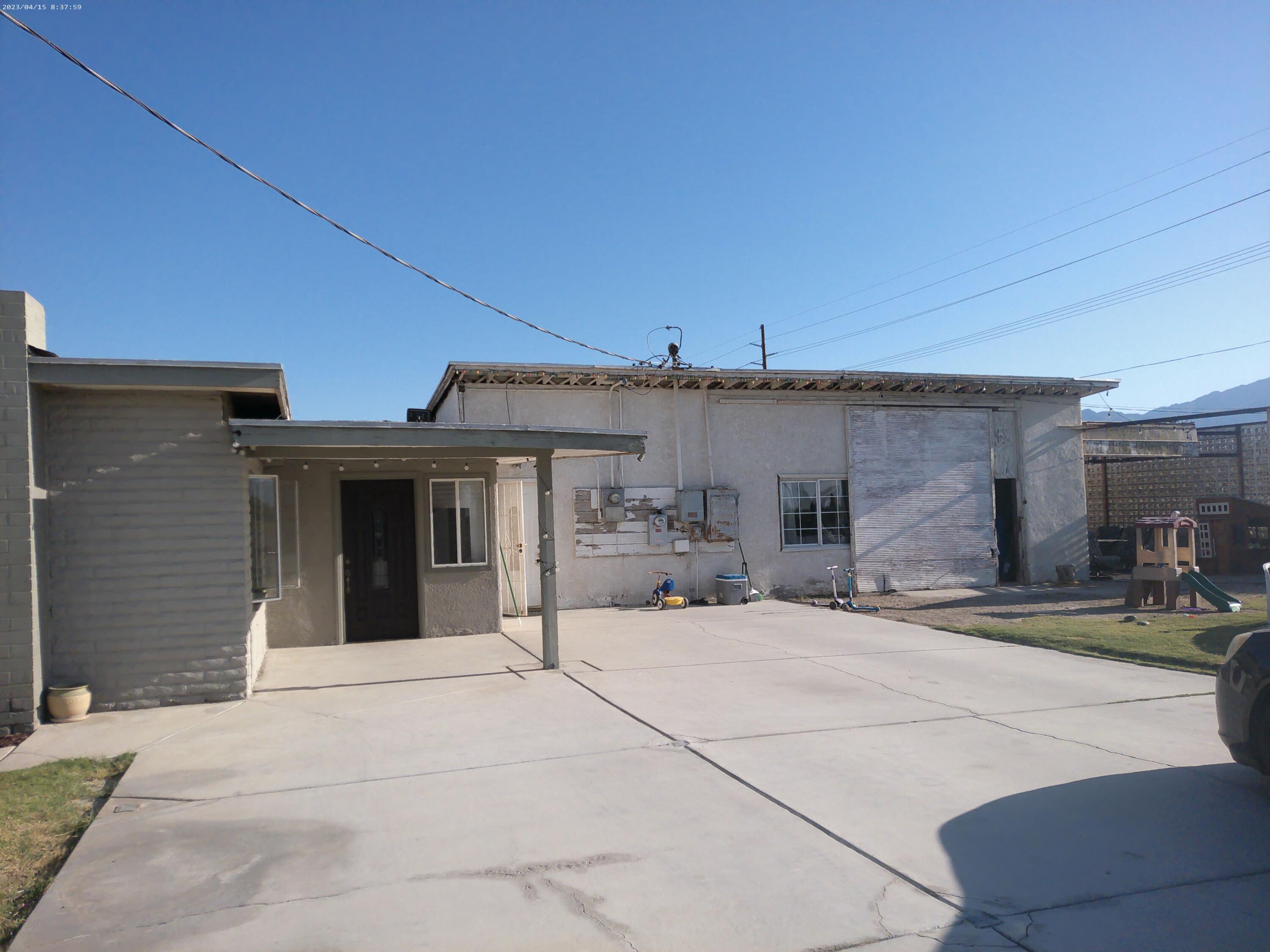 54878 Harrison Street Thermal, CA 92274 - Photo 39 of 58 a view of a house with patio