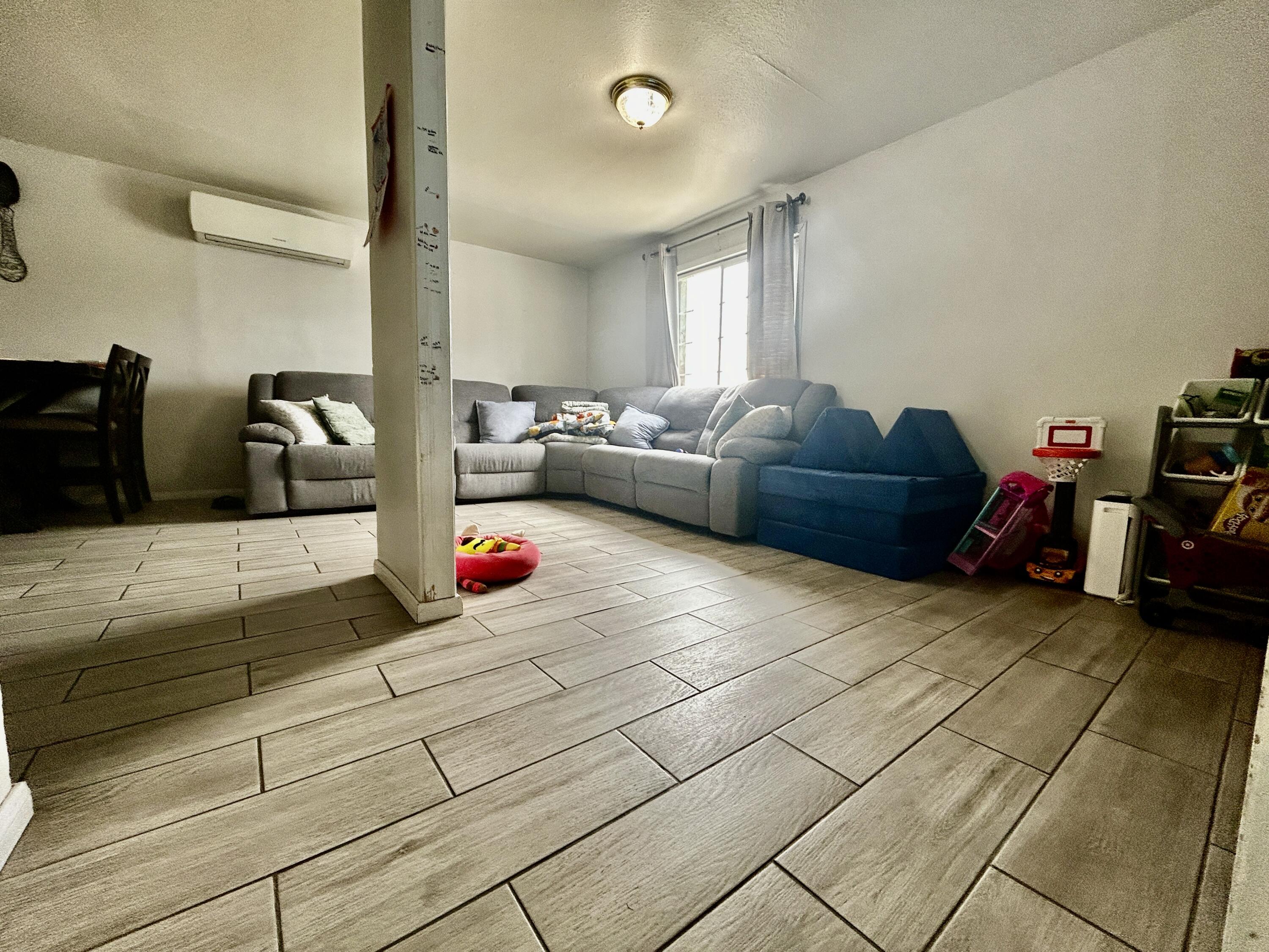 54878 Harrison Street Thermal, CA 92274 - Photo 42 of 58 a living room with furniture and a couch