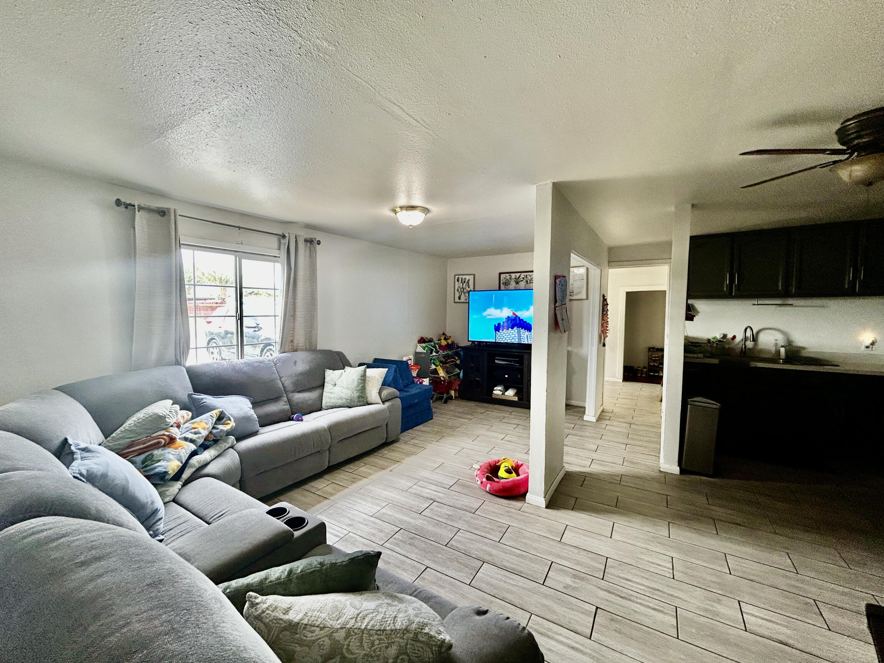 54878 Harrison Street Thermal, CA 92274 - Photo 43 of 58 a living room with furniture and a flat screen tv