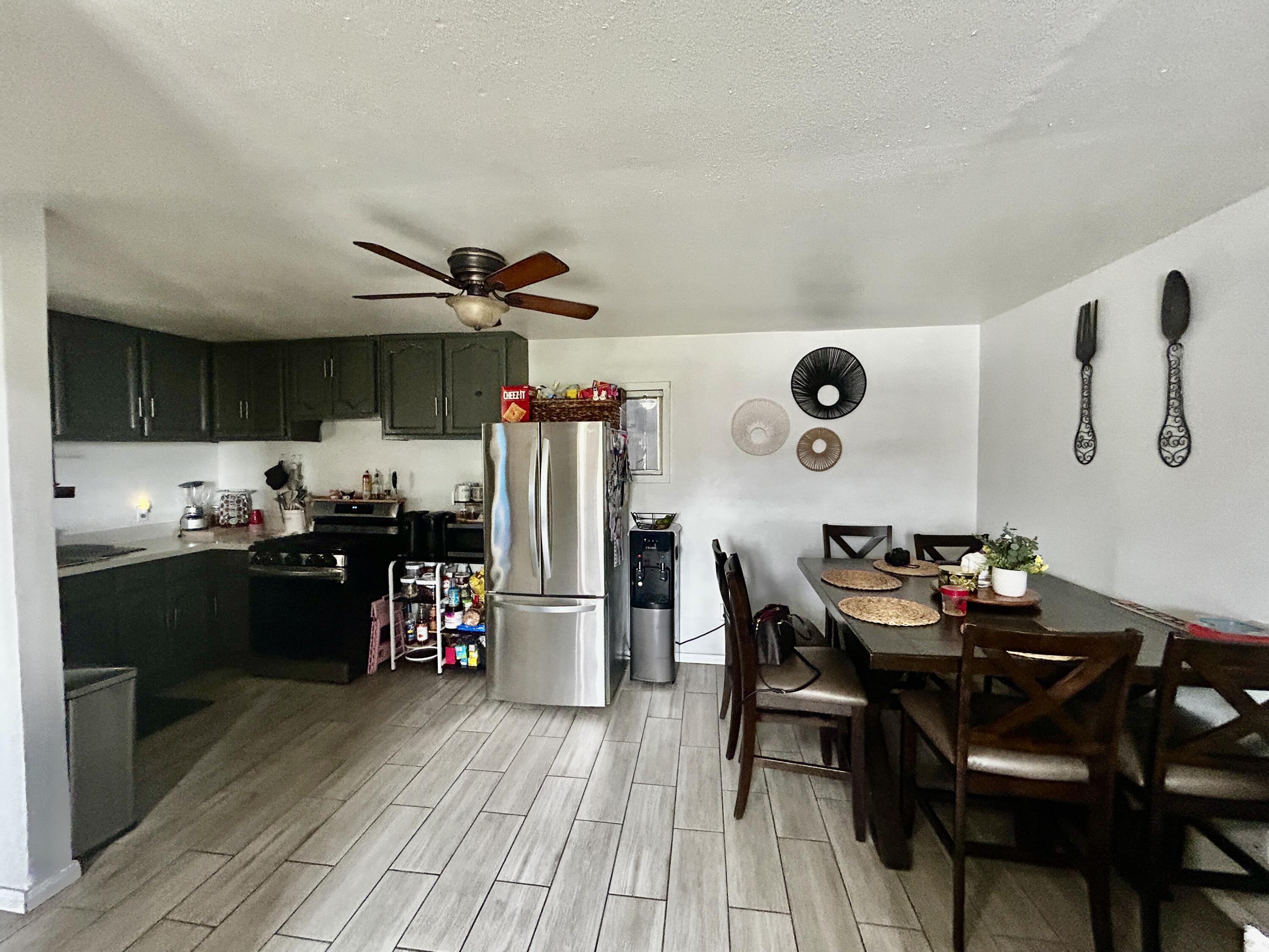 54878 Harrison Street Thermal, CA 92274 - Photo 44 of 58 a view of a dining room with furniture and wooden floor