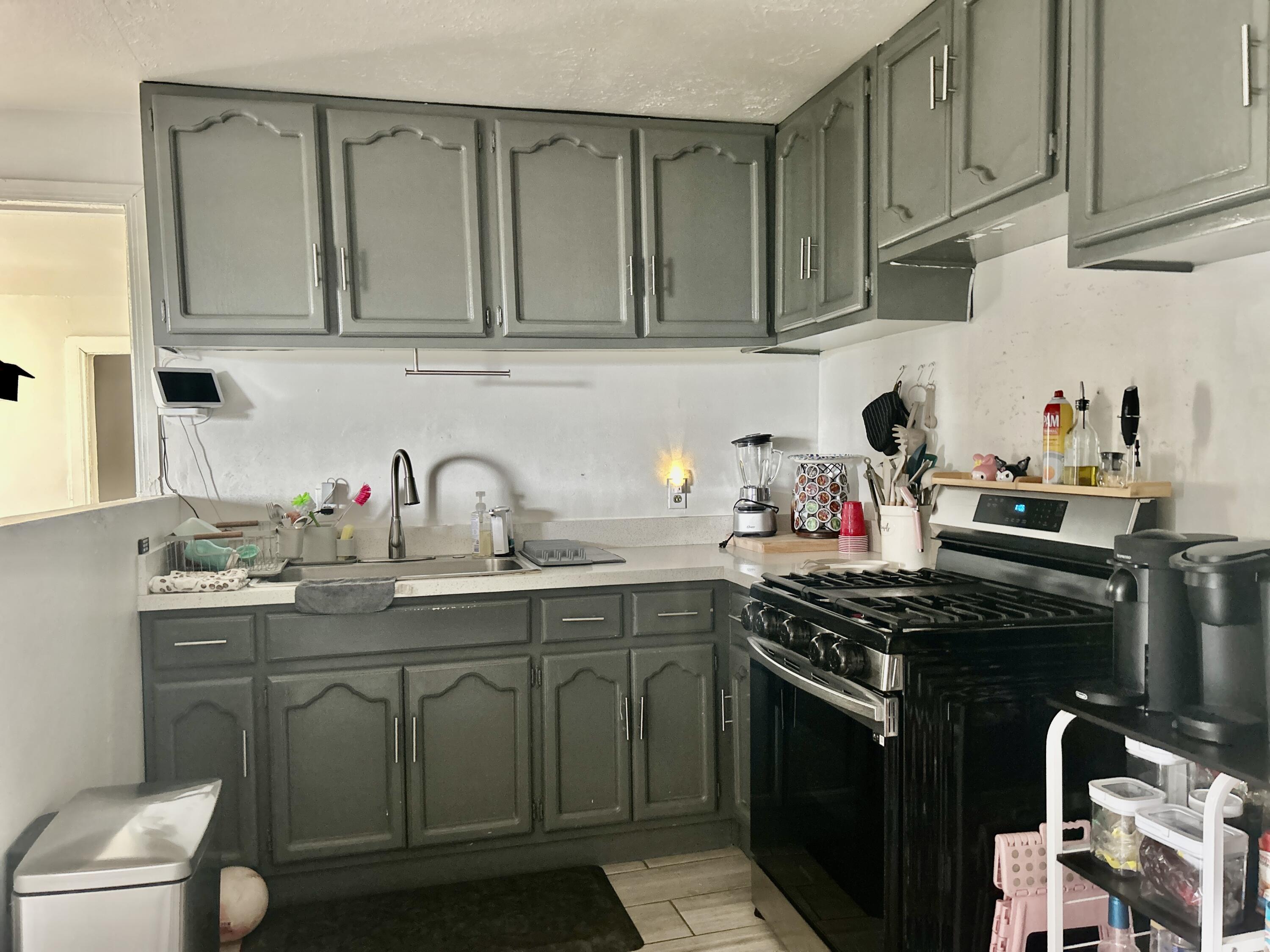 54878 Harrison Street Thermal, CA 92274 - Photo 45 of 58 a kitchen with stainless steel appliances granite countertop a sink stove and cabinets