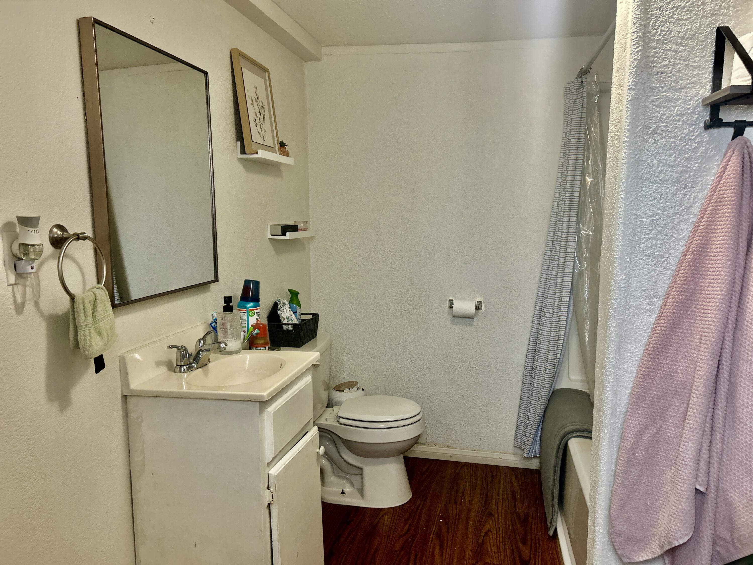 54878 Harrison Street Thermal, CA 92274 - Photo 49 of 58 a bathroom with a sink a toilet and a mirror