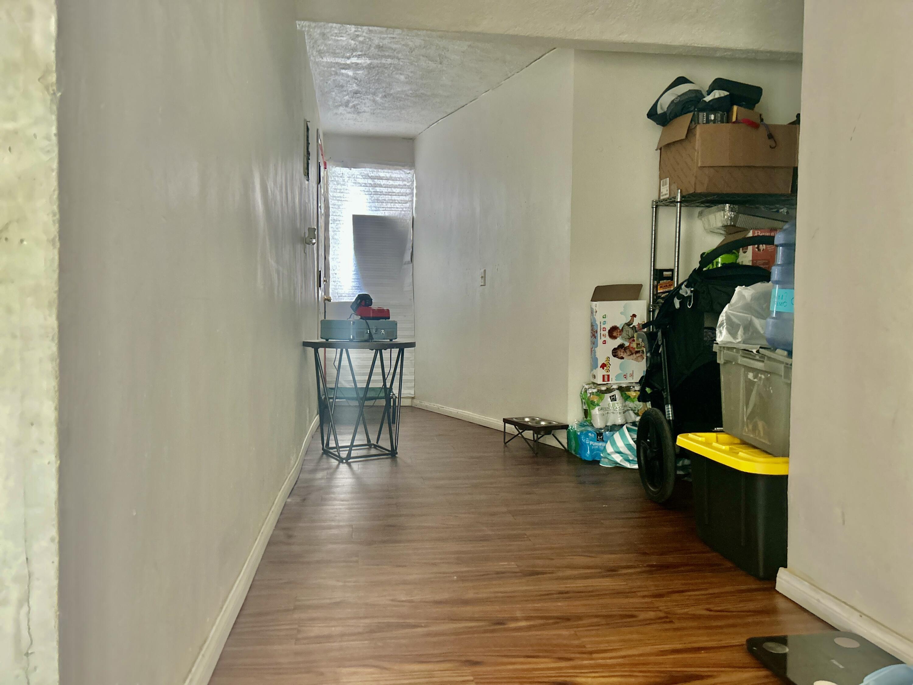54878 Harrison Street Thermal, CA 92274 - Photo 50 of 58 a view of a hallway to a house and wooden floor