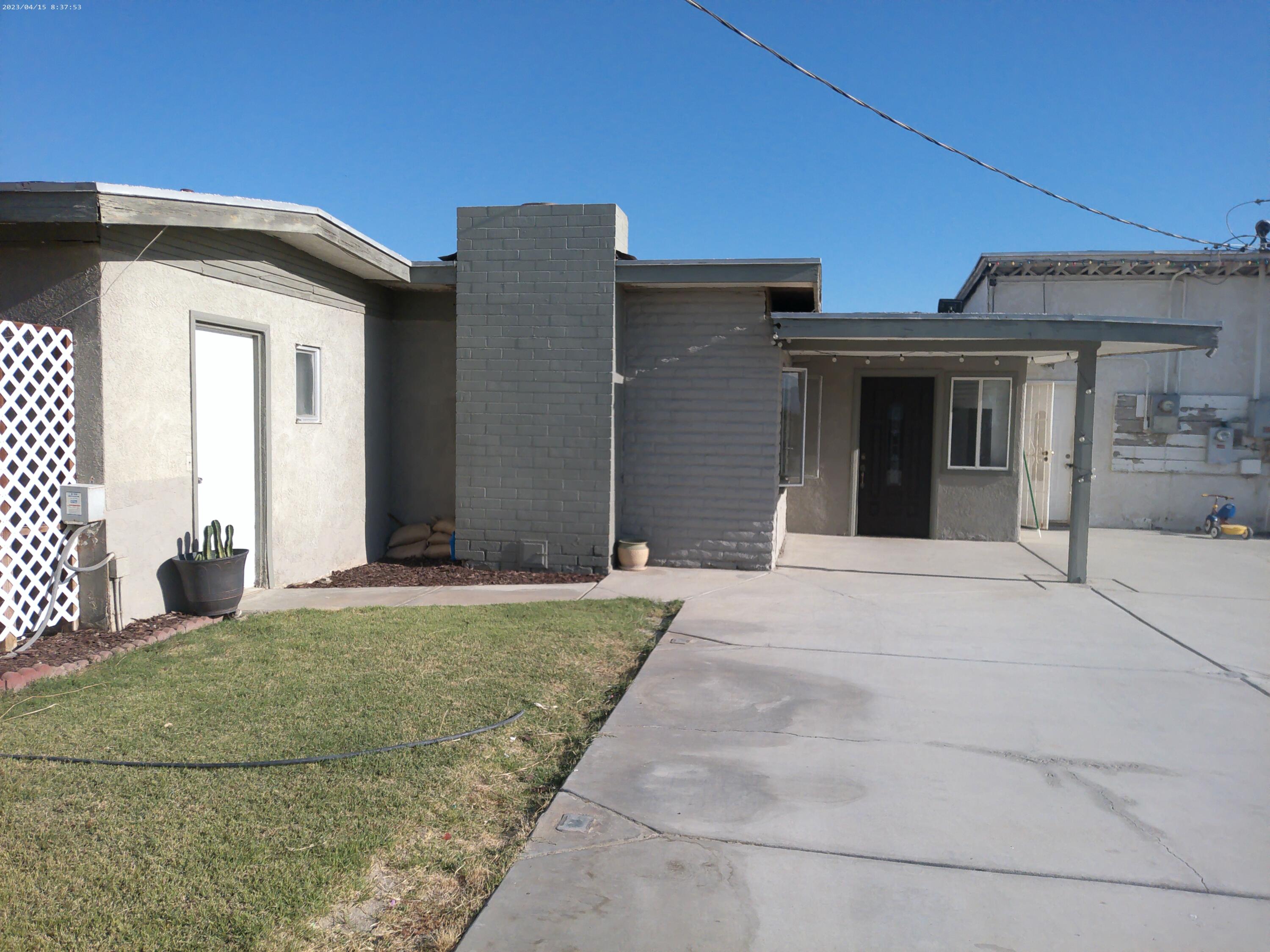 54878 Harrison Street Thermal, CA 92274 - Photo 7 of 58 a view of a house with a yard