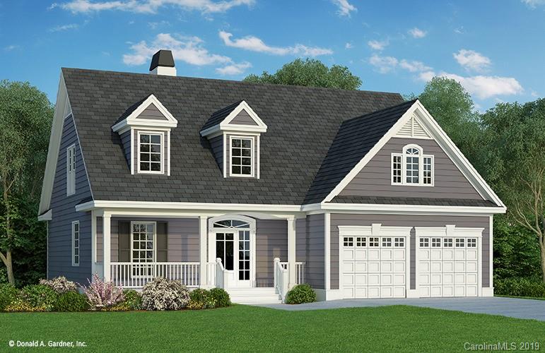 a view of a brick house with a yard