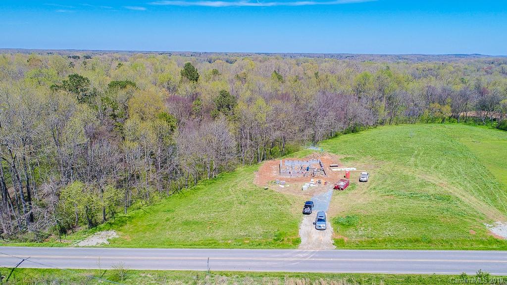 4723 Olive Branch Road Wingate, NC 28174 - Photo 4 of 6 a view of a yard with an outdoor space