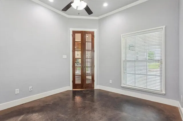 an empty room with windows and closet