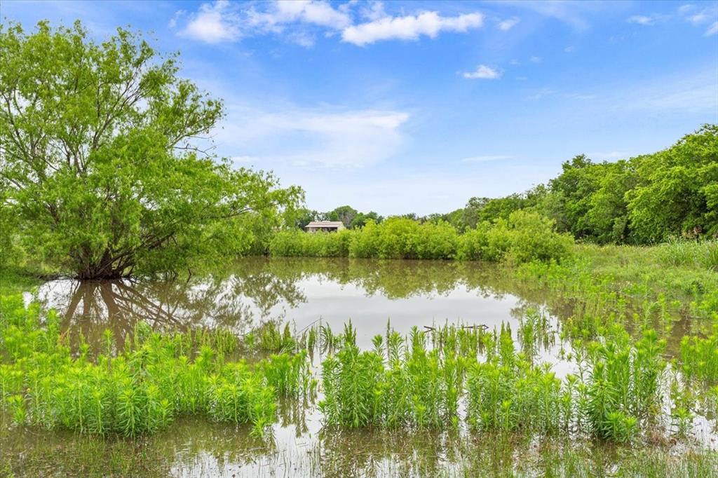 259 County Road 149 Riesel, TX 76682 - Photo 40 of 40 a view of a lake with houses in the back