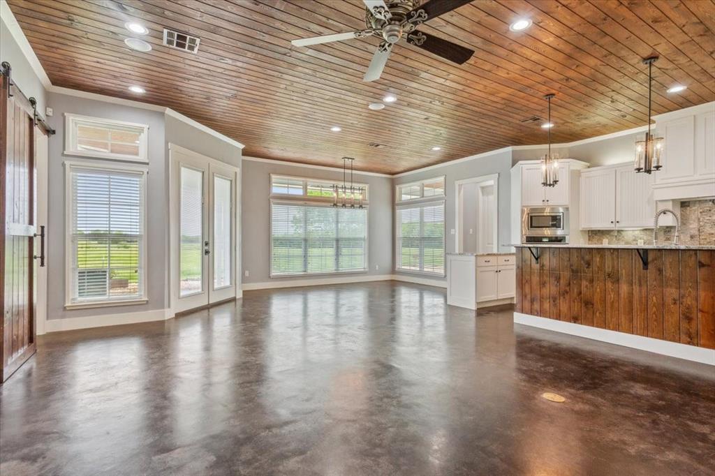 259 County Road 149 Riesel, TX 76682 - Photo 9 of 40 a view of empty room with wooden floor and fan