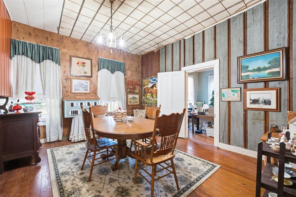 409 China Street Calvert, TX 77837 - Photo 6 of 18 a view of a dining room with furniture window and wooden floor