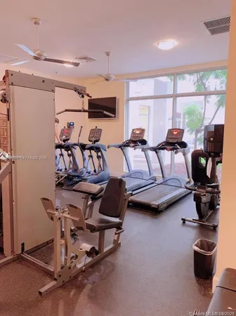 a view of a livingroom with furniture and stairs