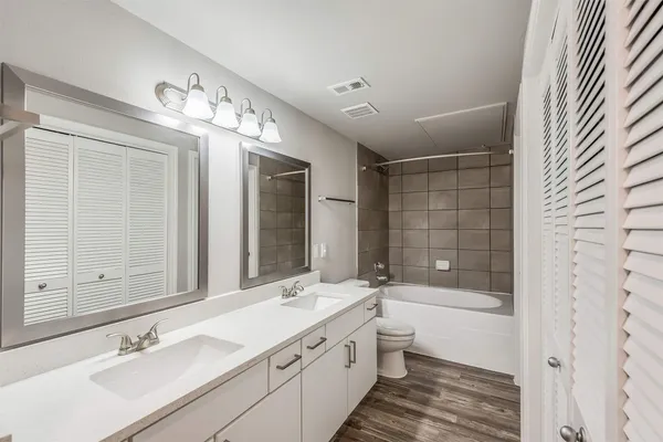 a kitchen with a sink a stove and cabinets