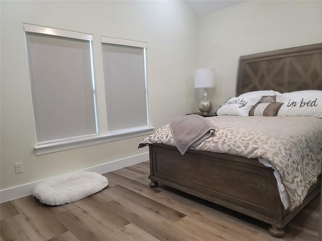 4825 Wichita Street Granbury, TX 76048 - Photo 20 of 30 a bedroom with a bed and a window