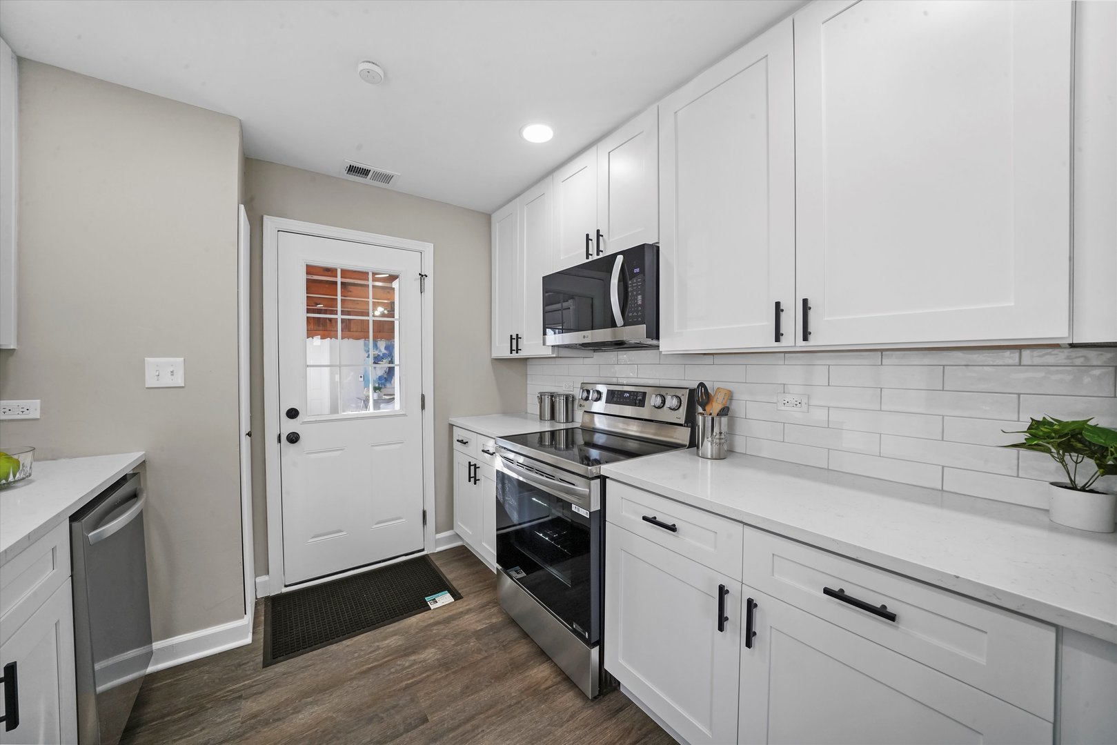 2243 Spruce Road Homewood, IL 60430 - Photo 6 of 22 a kitchen with a sink stove and microwave
