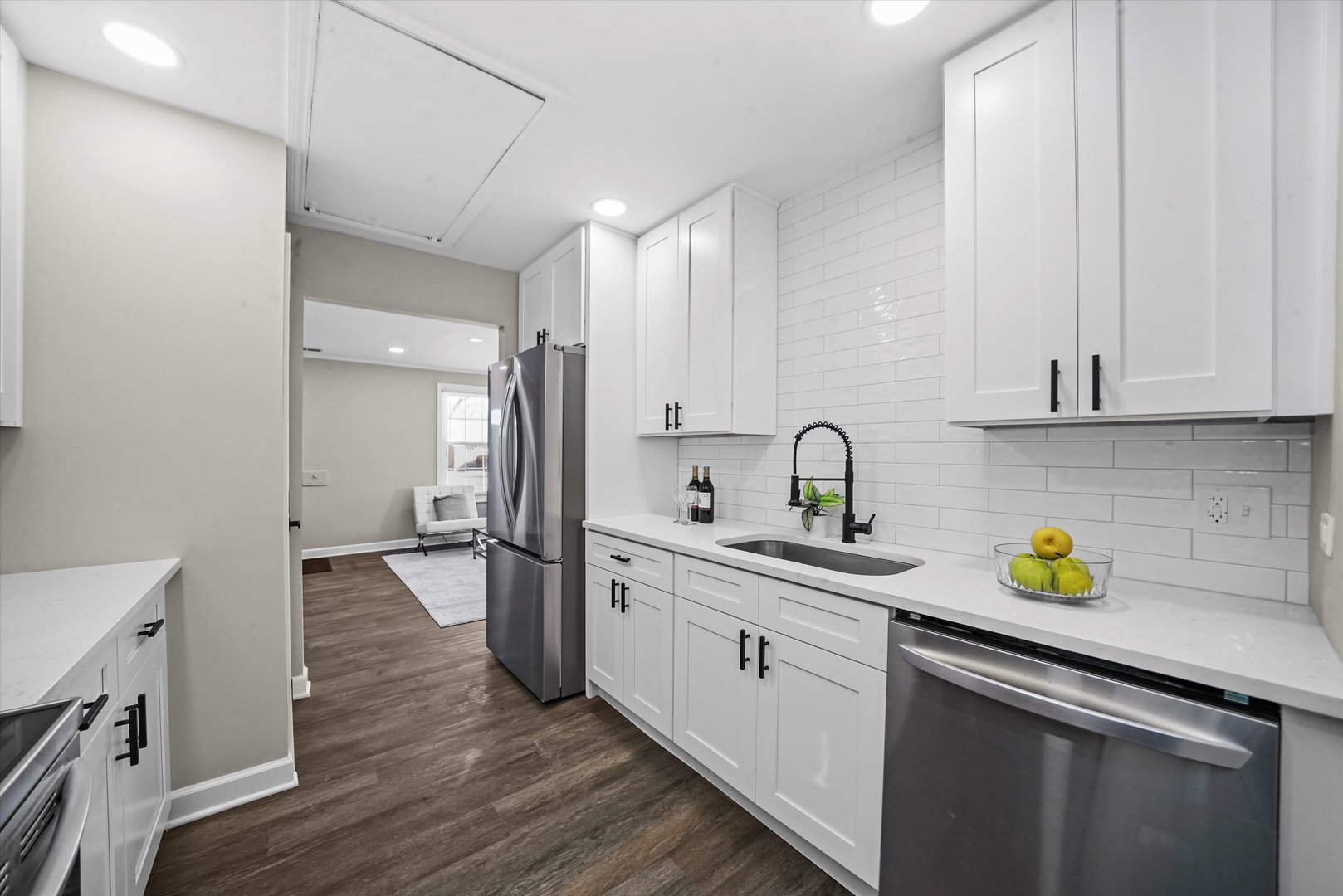 2243 Spruce Road Homewood, IL 60430 - Photo 7 of 22 a kitchen with a sink stainless steel appliances and cabinets