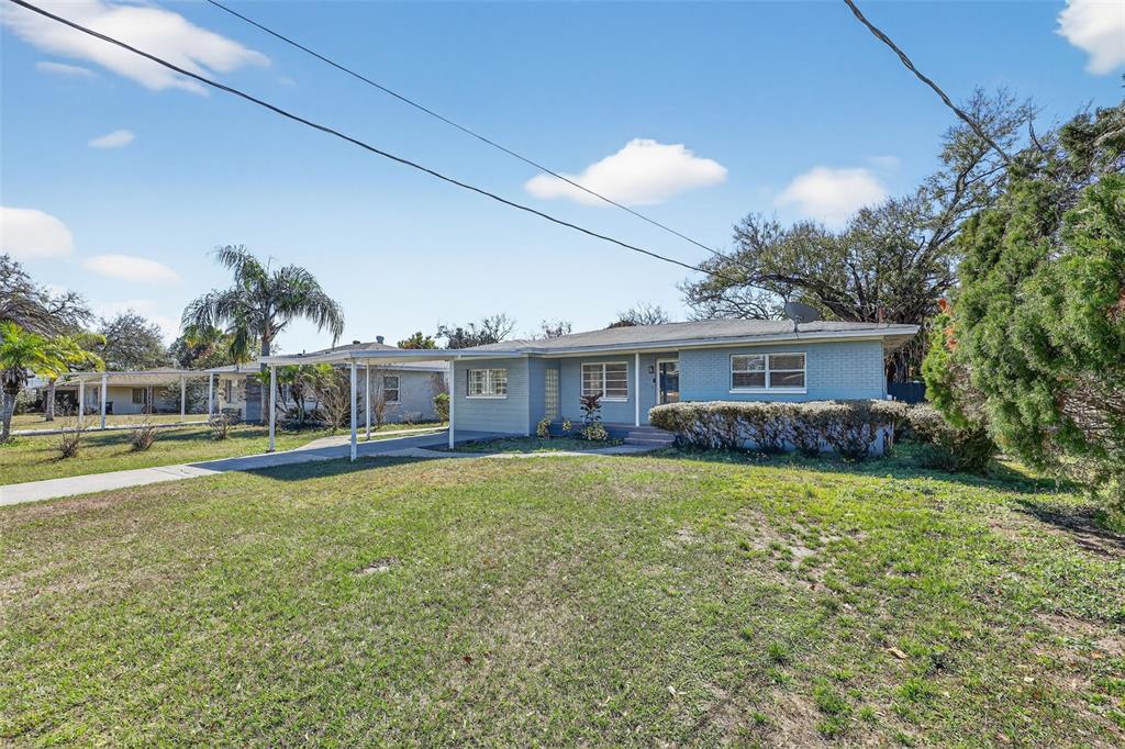 2714 West Grace Street Tampa, FL 33607 - Photo 3 of 26 a view of a house with swimming pool and a yard