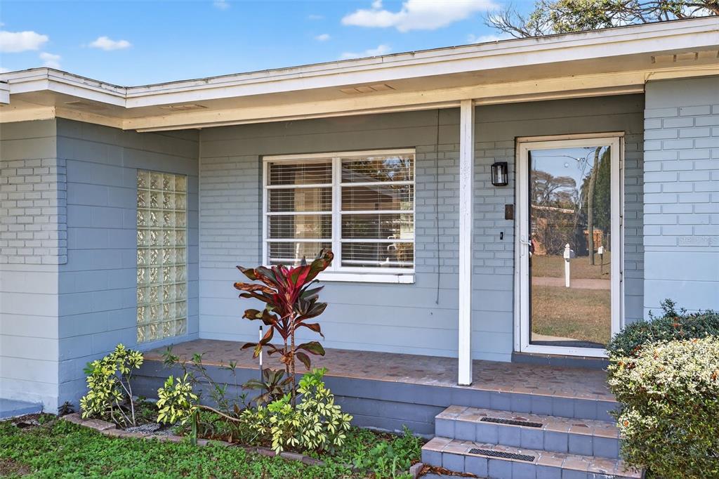 2714 West Grace Street Tampa, FL 33607 - Photo 4 of 26 a front view of a house with a yard