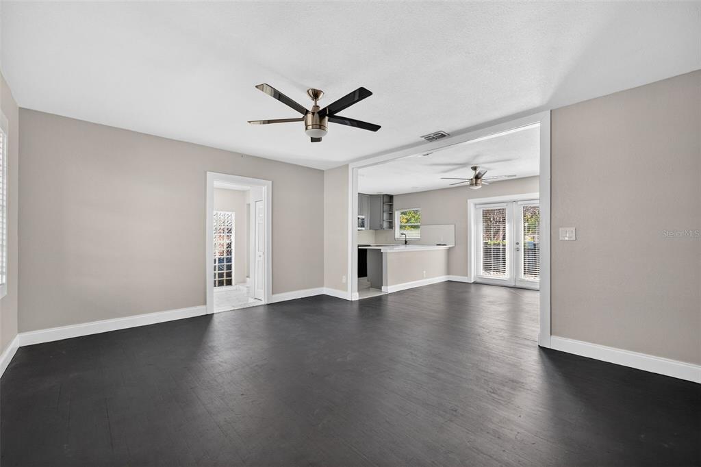 2714 West Grace Street Tampa, FL 33607 - Photo 5 of 26 a view of empty room with wooden floor and window