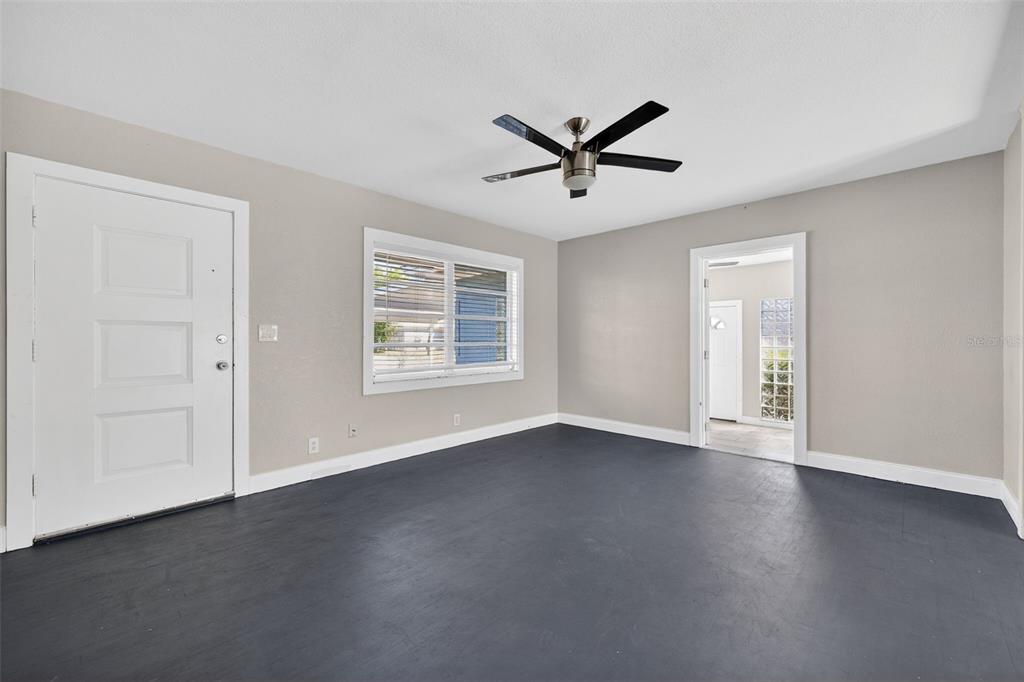 2714 West Grace Street Tampa, FL 33607 - Photo 6 of 26 a view of a big room with wooden floor closet and windows