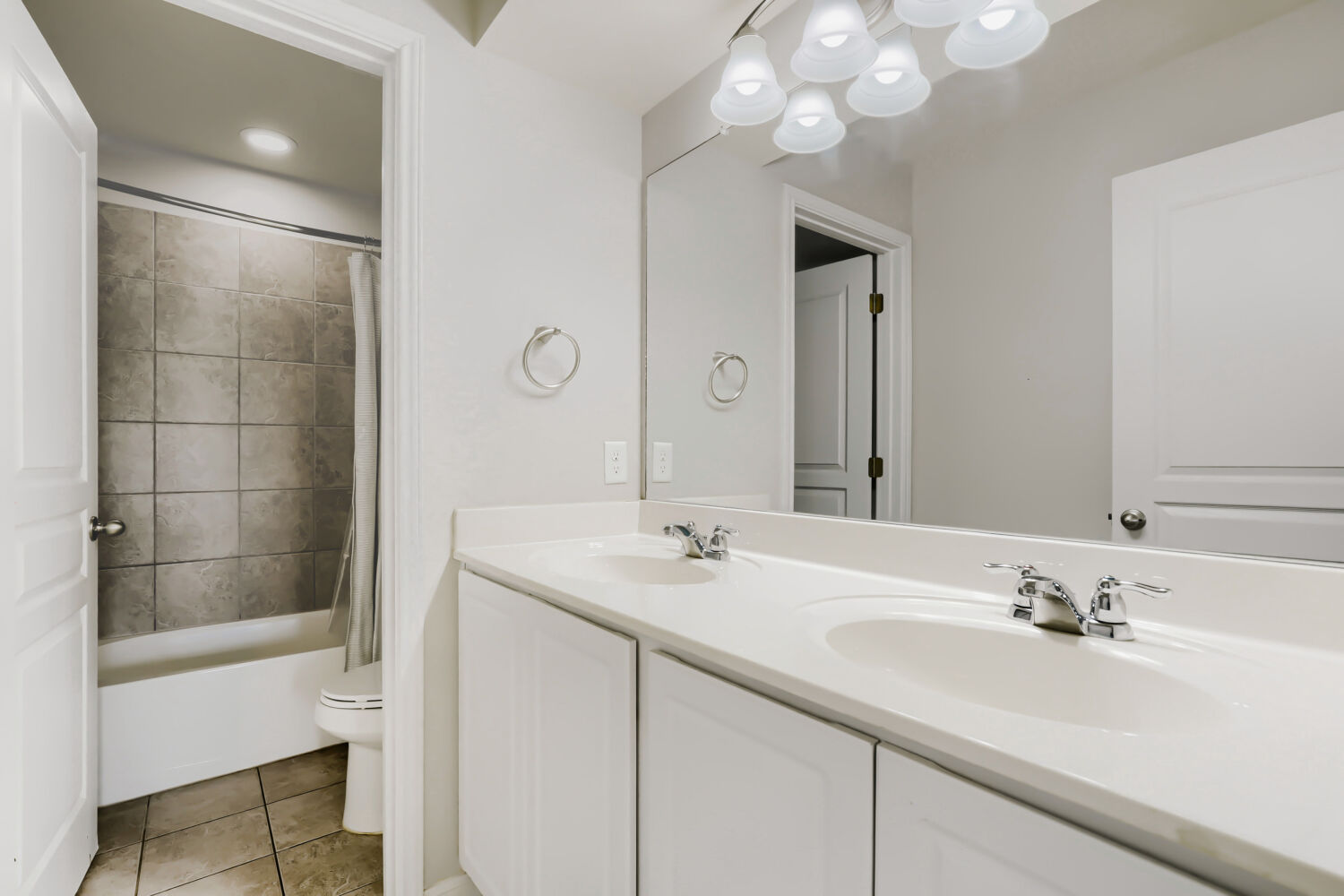 5136 Hellman Kyle, TX 78640 - Photo 22 of 25 a bathroom with a sink vanity granite shower and a mirror